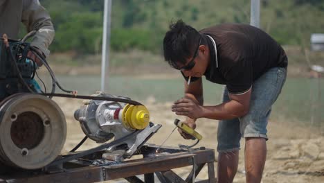 worker welding engine components