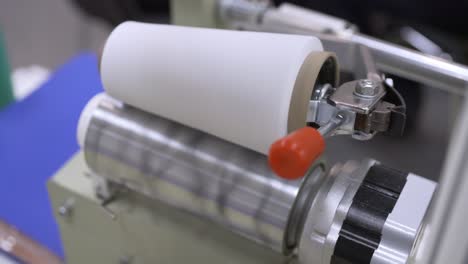 Machine-for-winding-threads-on-bobbins