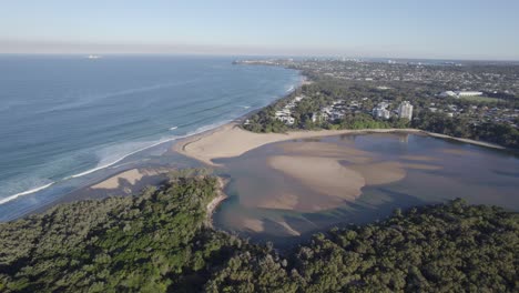 currimundi creek meets the sea in wurtulla, sunshine coast, queensland