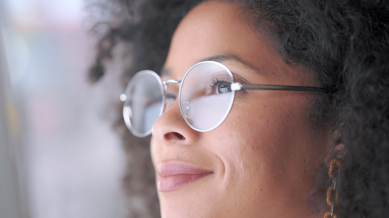 Closeup of thinking businesswoman wearing vision