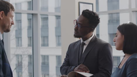 lawyers talking with client in the office