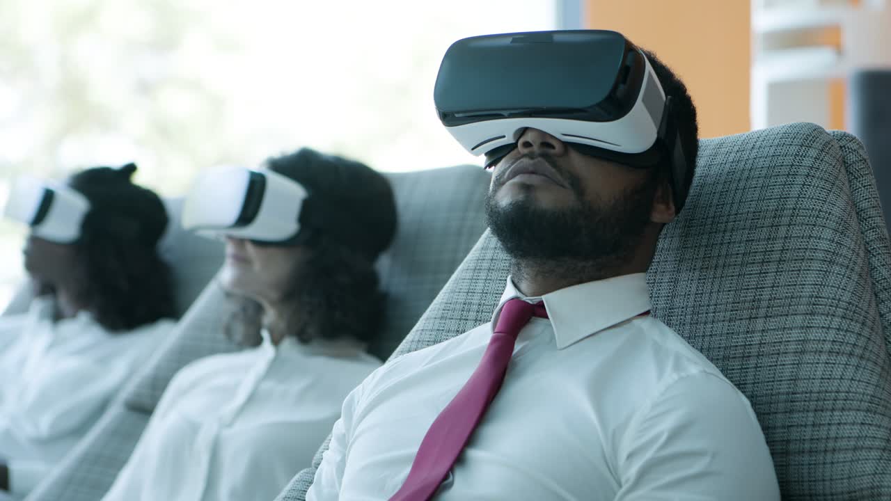 Business people in virtual reality headsets