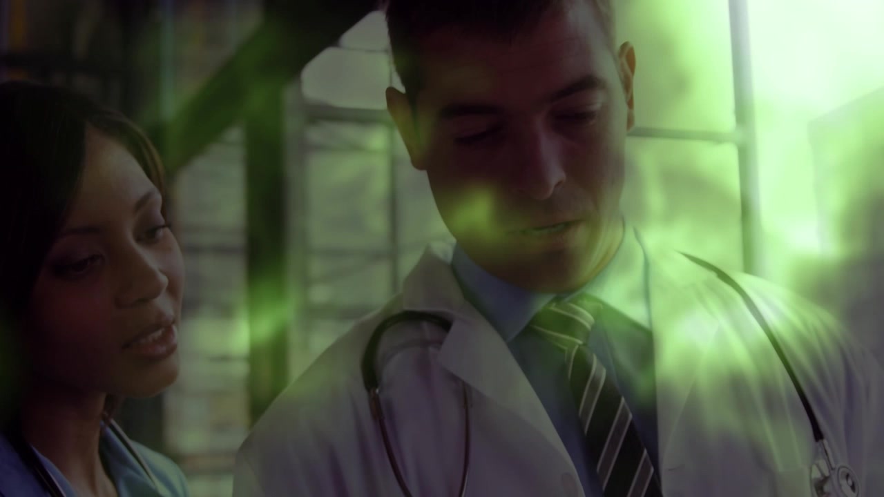 Animation of light spots over diverse doctors smiling
