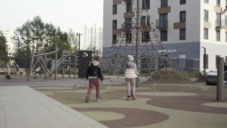 children playing in a city park playground