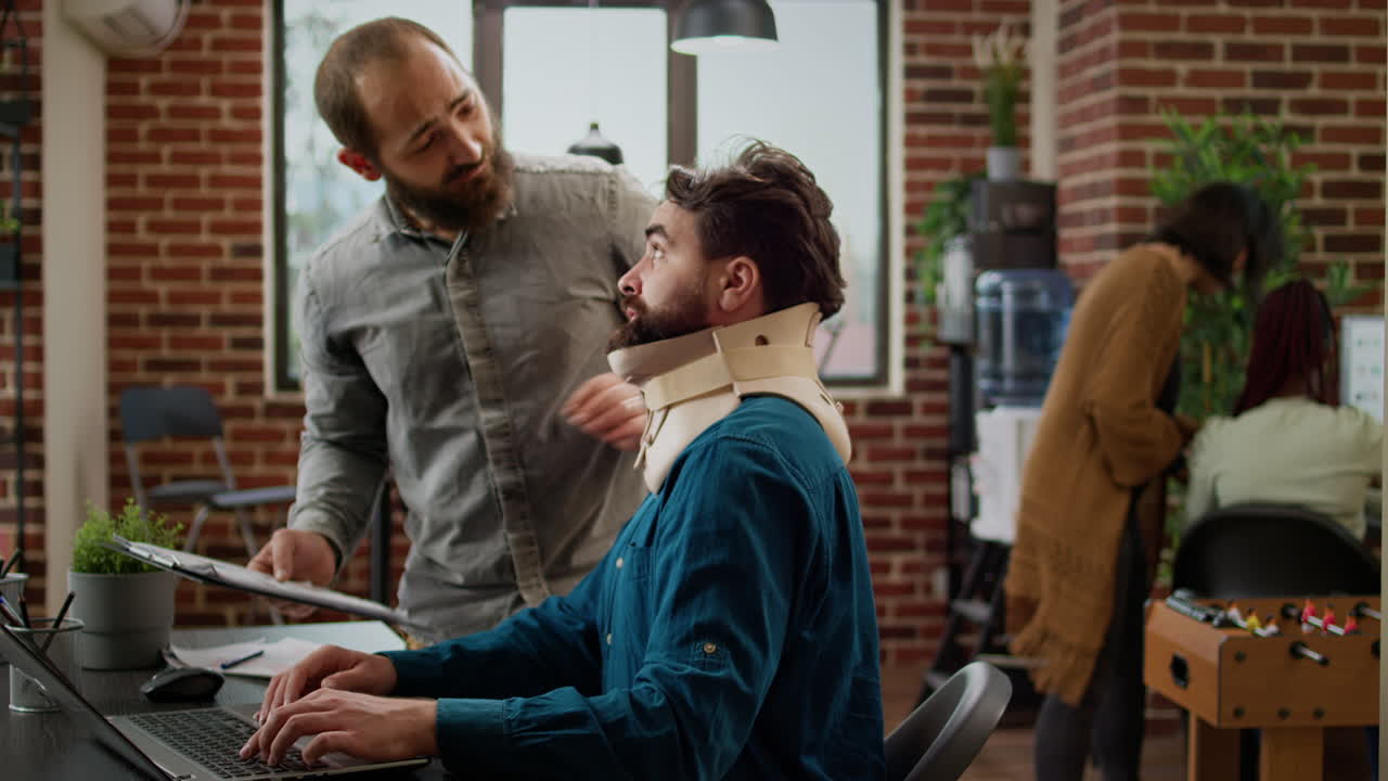 Hurt company employee with cervical collar after physical accident