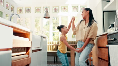 Kitchen,-happy-and-mother-dancing-with-her-child