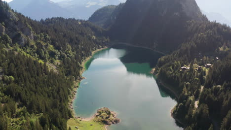 high overview of stunning lake surrounded by mountains and forest