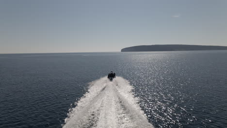 zodiac boat passing in front of famous perce rock