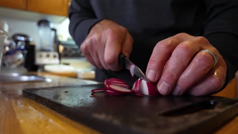 cutting radishes - making a salad in an italian kitchen 60fps slow motion