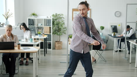 employees dancing in the office