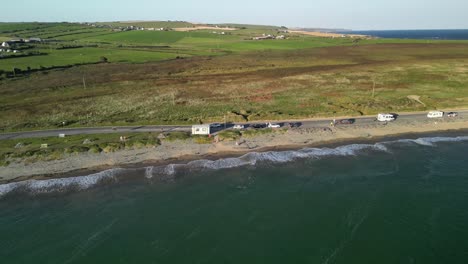 garrylucas beach aerial with green rural fields and homes, county cork, ireland, wild atlantic way