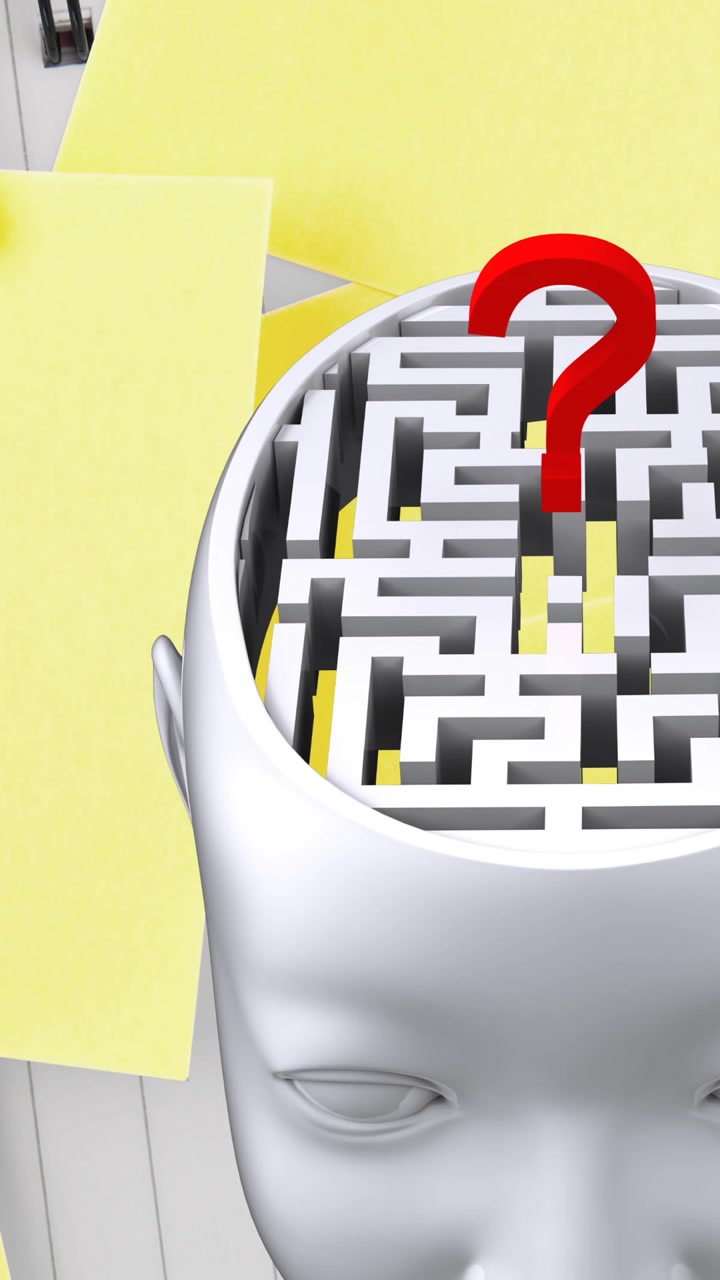 Animazione di pezzi di puzzle verdi, gialli e rossi che cadono su una testa umana con un labirinto e un punto interrogativo