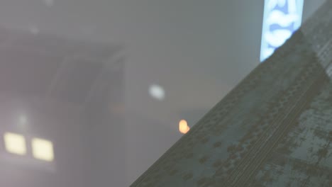 neon lights in soft focus on street with fog at night