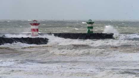 stormy waves crashing against a breakwater with lighthouses