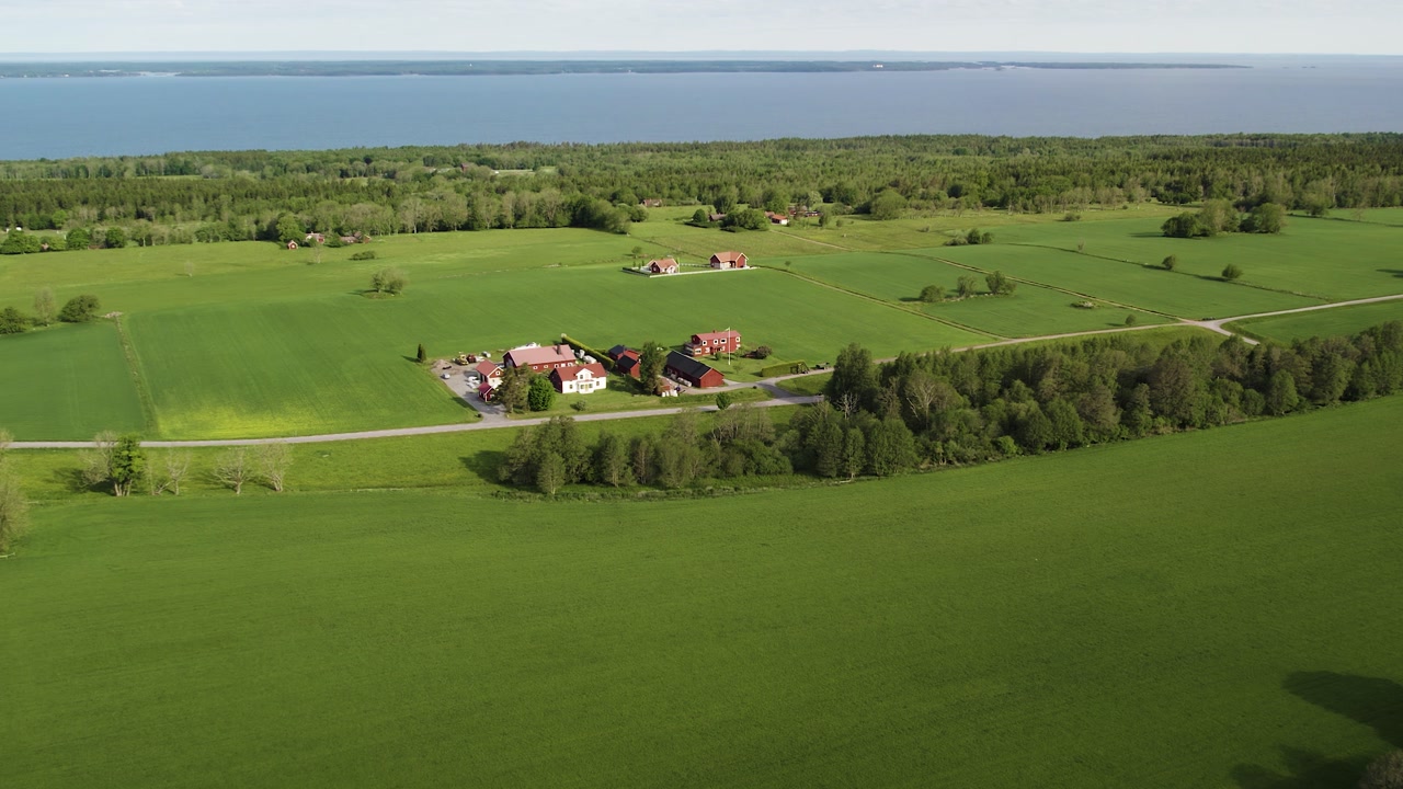 Country Homes Amidst Green Fields In Kinnekulle, Sweden. Aerial Drone Shot