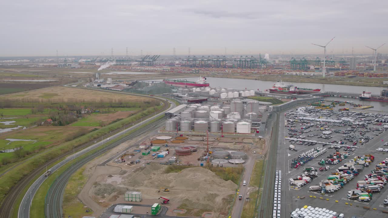 Massive cargo vessels of harbour in Belgium, aerial drone view