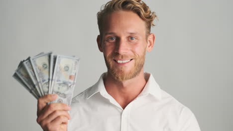 young man counting banknotes