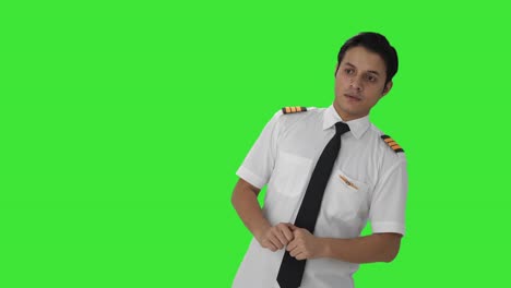 indian pilot doing inspection before flight green screen