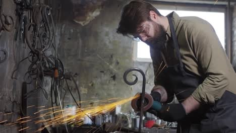 blacksmith working with emery machine