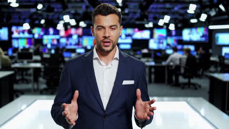 male news anchor speaking in a broadcast studio
