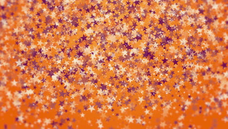 gold and purple star confetti rain festive holiday on orange background. loop animation.