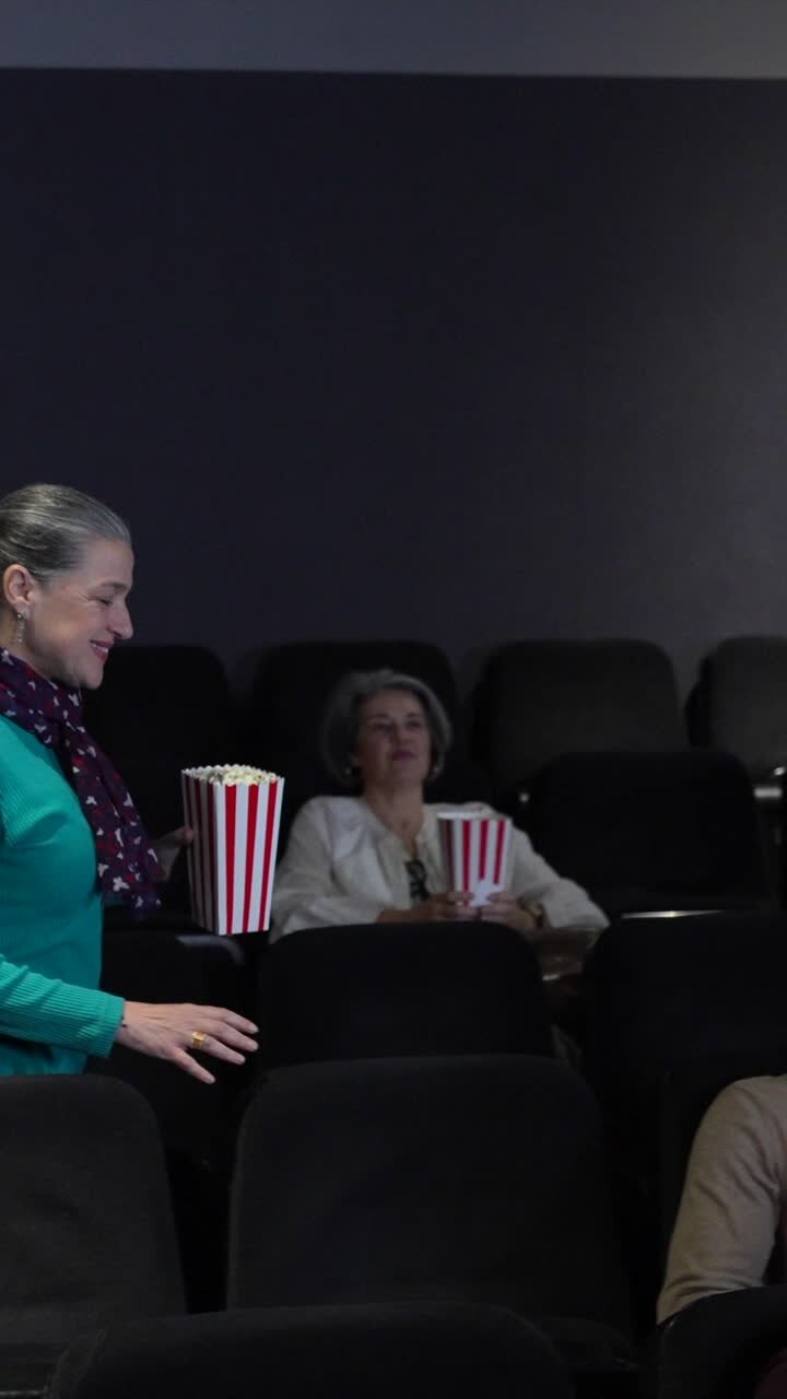 People enjoying a movie at the theater