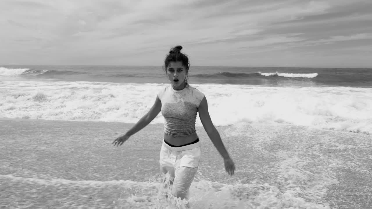 Woman on the beach in black and white