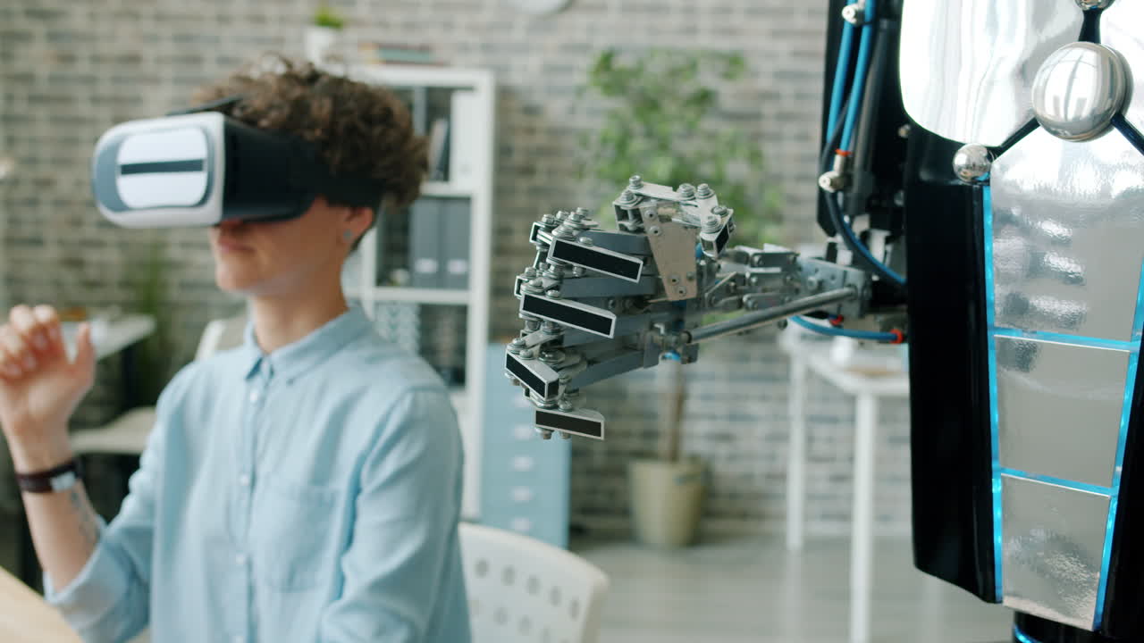 Person wearing VR headset interacting with a robot arm in an office setting