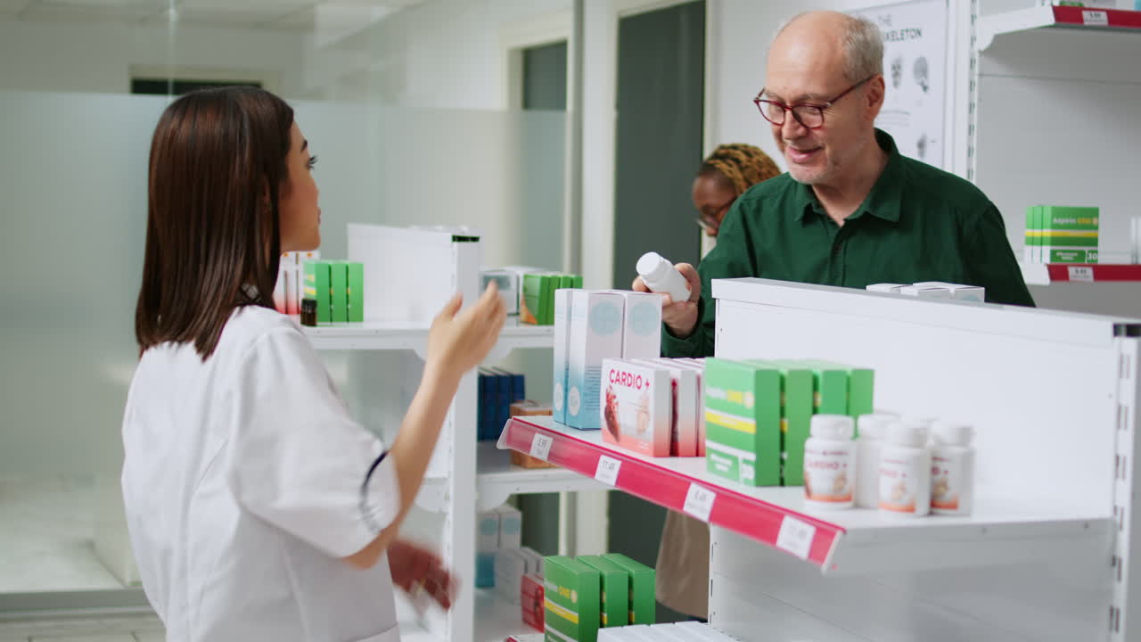 Pharmacist assisting customer with medication prescription in a pharmacy