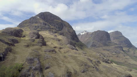 aerial footage of the three sisters mountain range in glencoe, scoottish highlands