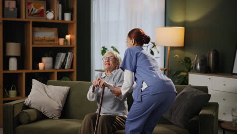 nurse assisting elderly woman at home