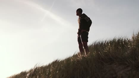 man standing on grass field