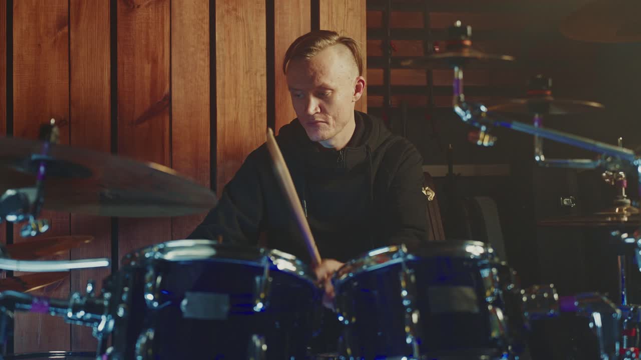 Drummer Playing Drums in Recording Studio