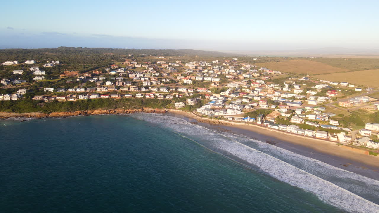High sunrise aerial view over ocean of scenic Vleesbaai with perfect sandy beach