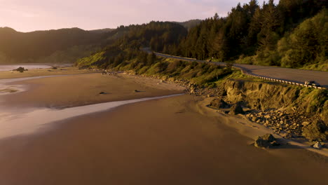 Drone-footage-of-flying-parallel-to-Highway-101-at-Myers-Creek-near-Gold-Beach,-Southern-Oregon,-USA