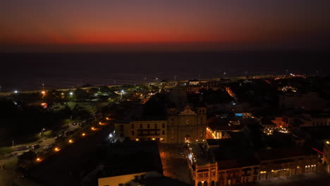 Santuario-de-San-Pedro-Claver,-colorful-evening-in-Cartagena,-Colombia---Aerial-view