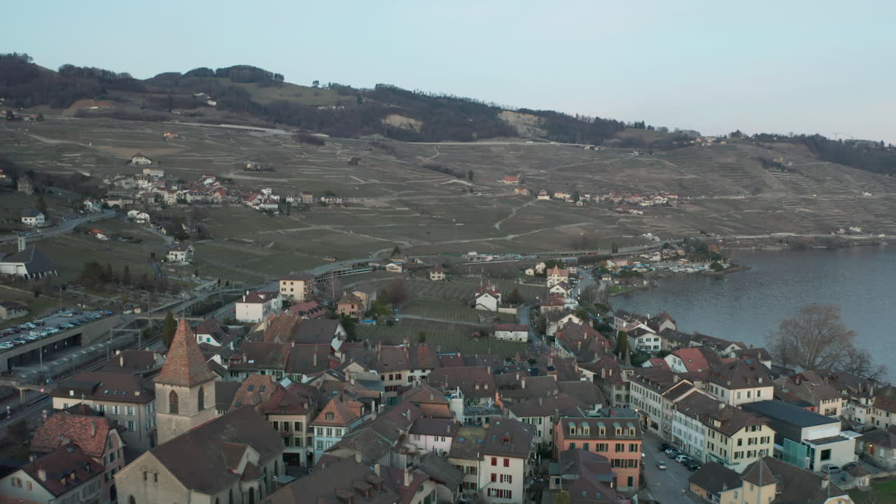 Aerial of beautiful Swiss town at the edge of lake