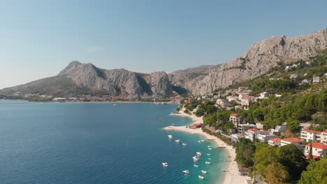 panoramic footage over beach and brzet, omis in croatia with the wonderful view over adriatic sea