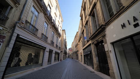 empty street and closed shops in montpellier city center during lockdown