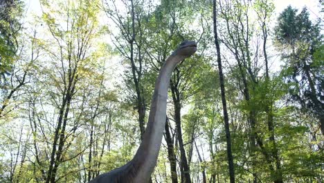 brachiosaurus statue in a forest