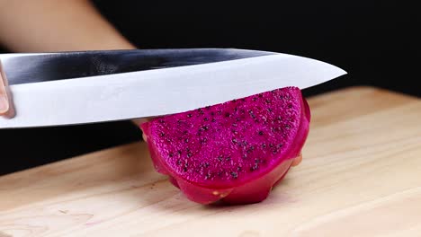 cutting dragon fruit into even slices