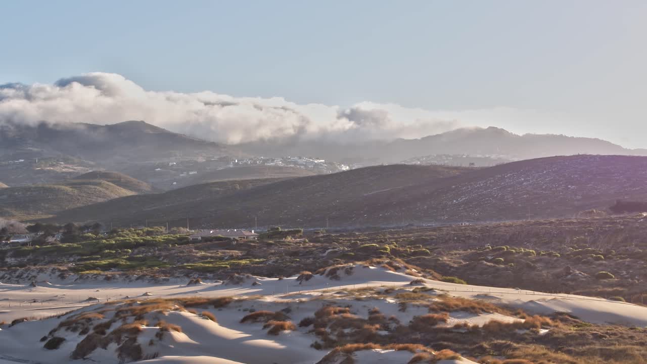 Aerial view of Portugal showcasing hills and sandy terrain in daylight