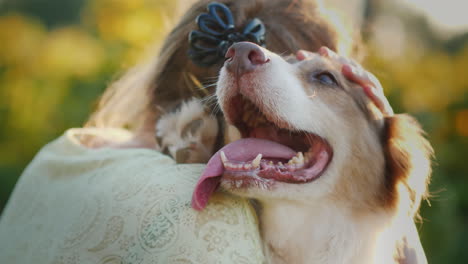 owner hugs his beloved dog