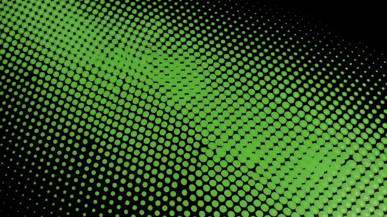 Animation abstraite d'un motif de points en demi-teinte verts sur fond noir