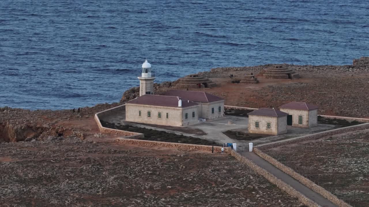 Menorca island coastline Punta Nati Lighthouse landmark aerial drone Spain