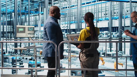 engineers meeting with smart factory investor, showing data