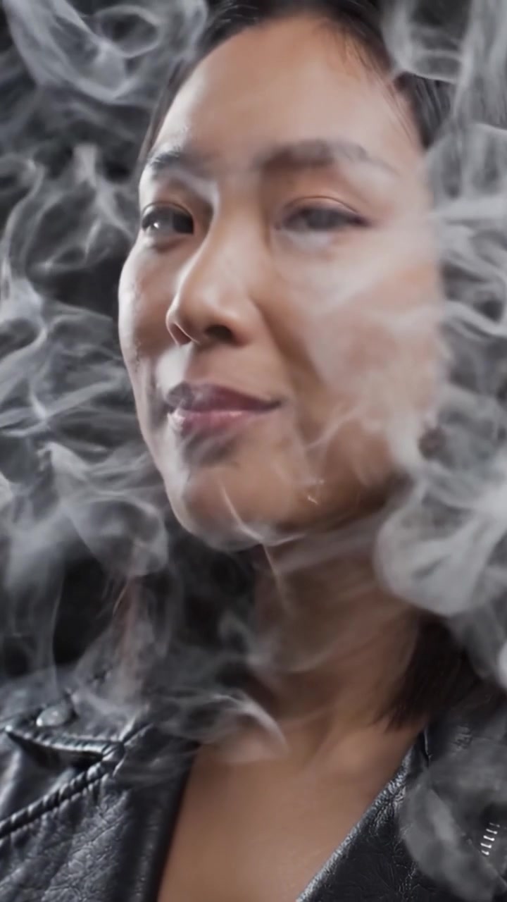 A Woman Enjoying the Experience of Vaping with Style and Confidence, Captured in Two Frames Highlighting Her Expression and the Cloud of Vapor