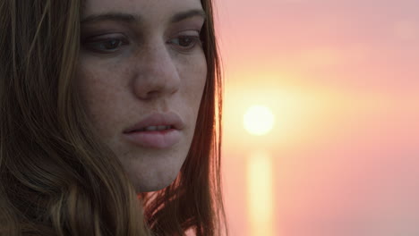 portrait-of-beautiful-young-woman-enjoying-peaceful-seaside-at-sunset-exploring-spirituality-contemplating-future