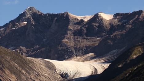 Remnants-of-a-once-large-Glacier-in-between-mountains-of-Alaska