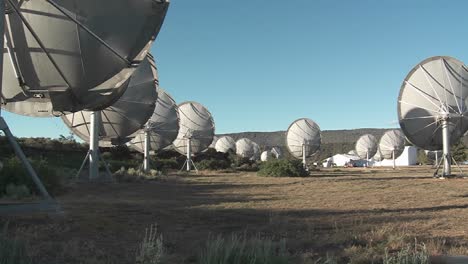 a timelapse of satellites simultaneously rotating as they search the heavens for extra terrestrial life